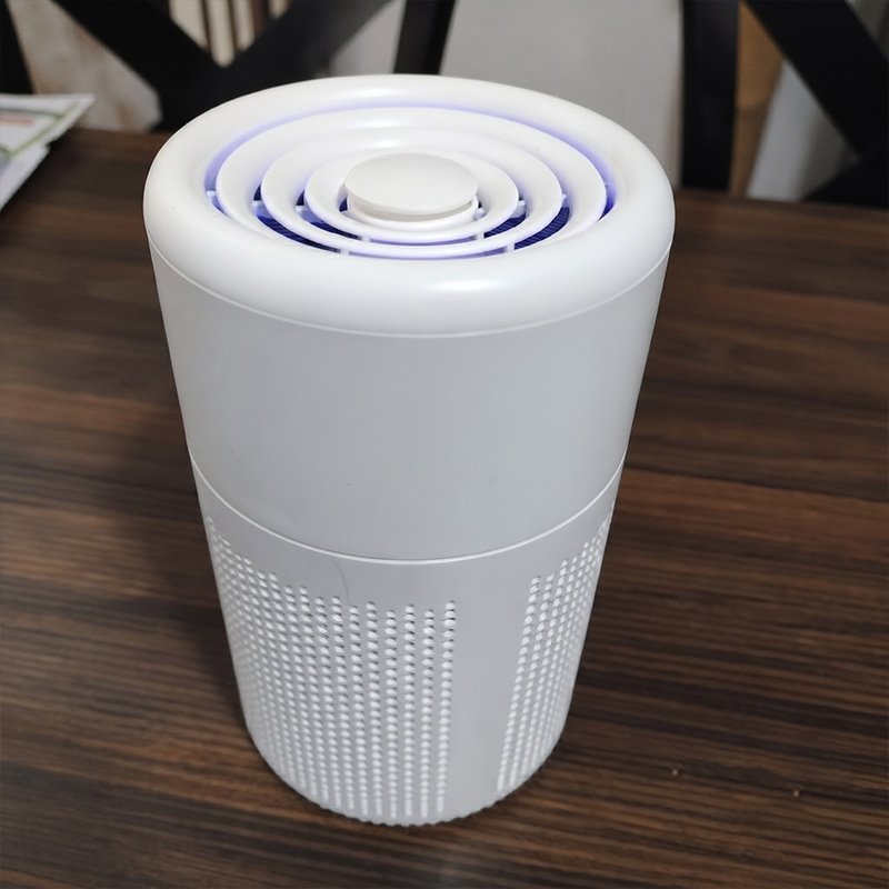 Coolizi PureAir Pro compact air cleaner on a side table