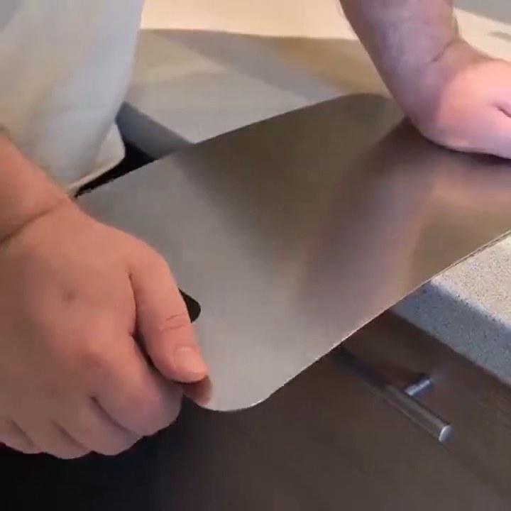 Vanotium titanium cutting board being handled